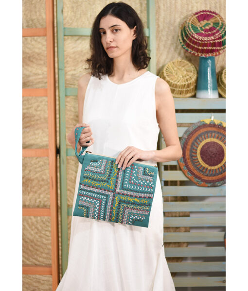Turquoise Embroidered Clutch handmade in Egypt & available at Jozee Boutique.