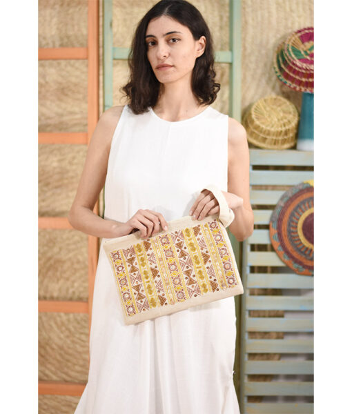 Off white Embroidered Clutch handmade in Egypt & available at Jozee Boutique.