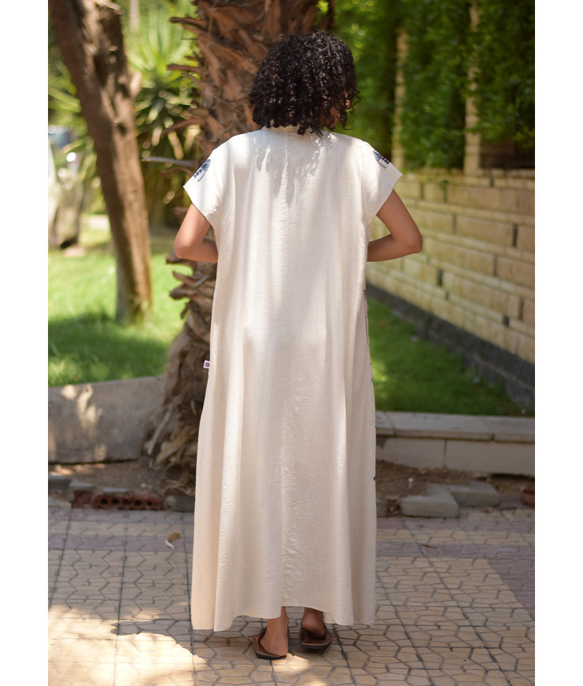 Off White Siwa Embroidered Linen Japanese Dress handmade in Egypt & available at Jozee Boutique.