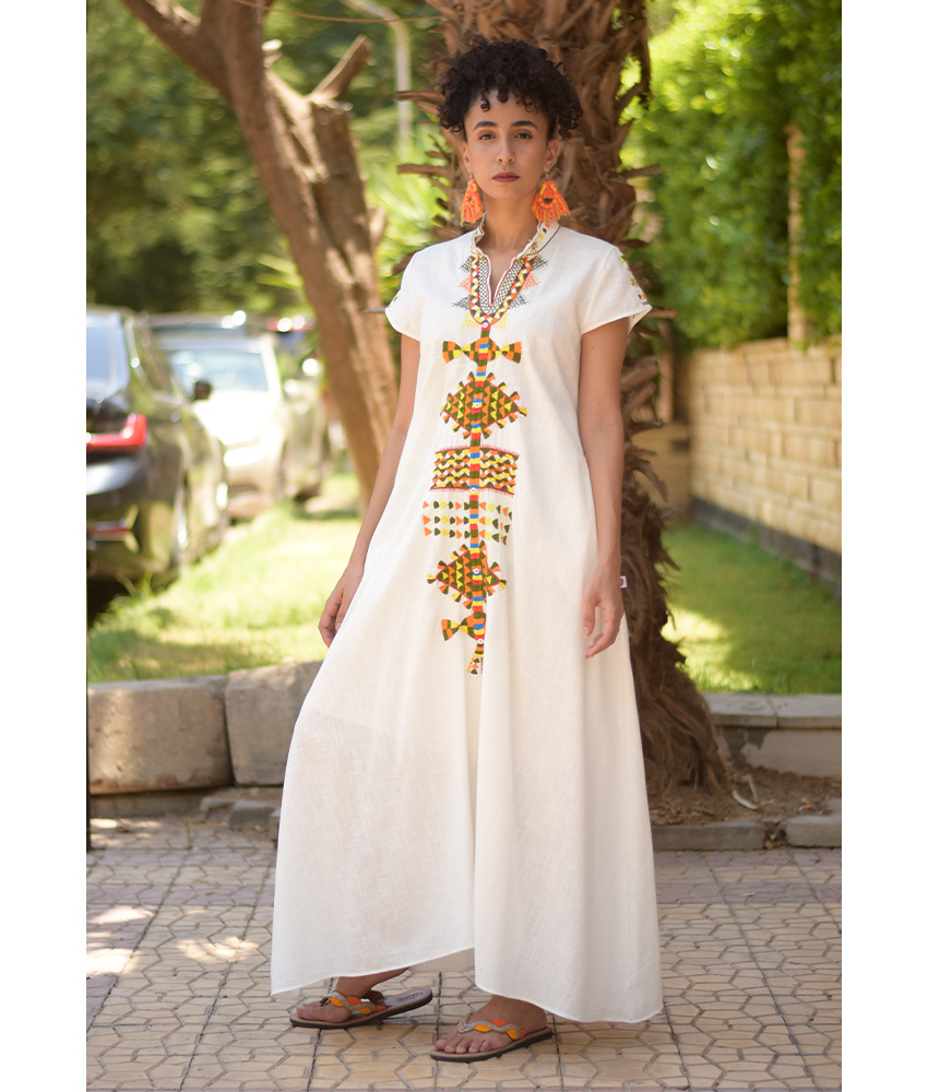 White Siwa Embroidered Linen Japanese Dress handmade in Egypt & available at Jozee Boutique.