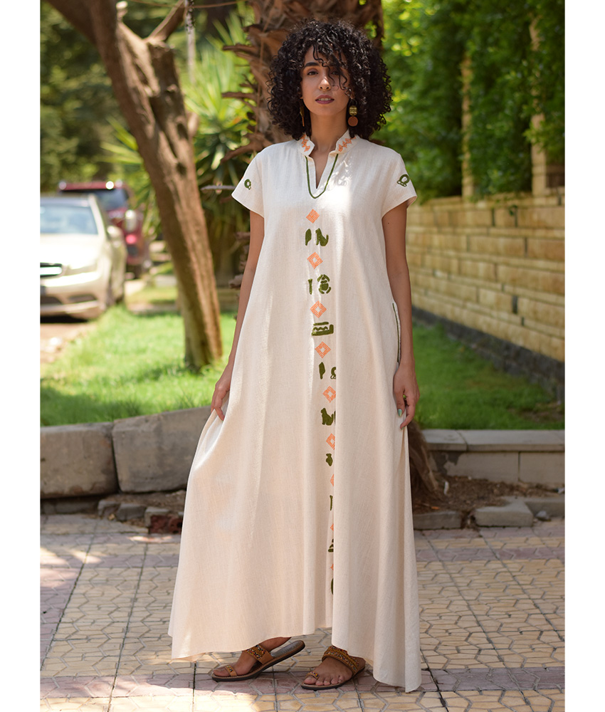 Off White Siwa Embroidered Linen Japanese Dress handmade in Egypt & available at Jozee Boutique.