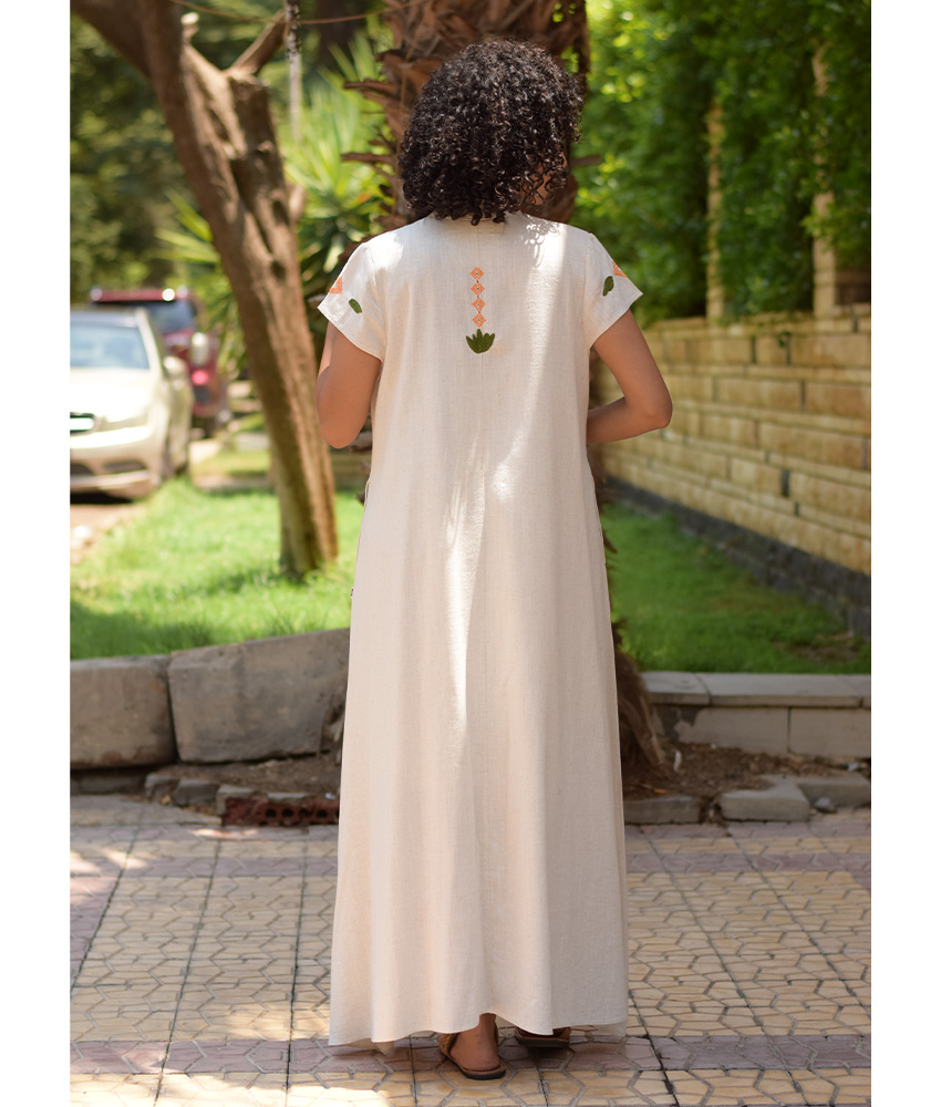 Off White Siwa Embroidered Linen Japanese Dress handmade in Egypt & available at Jozee Boutique.