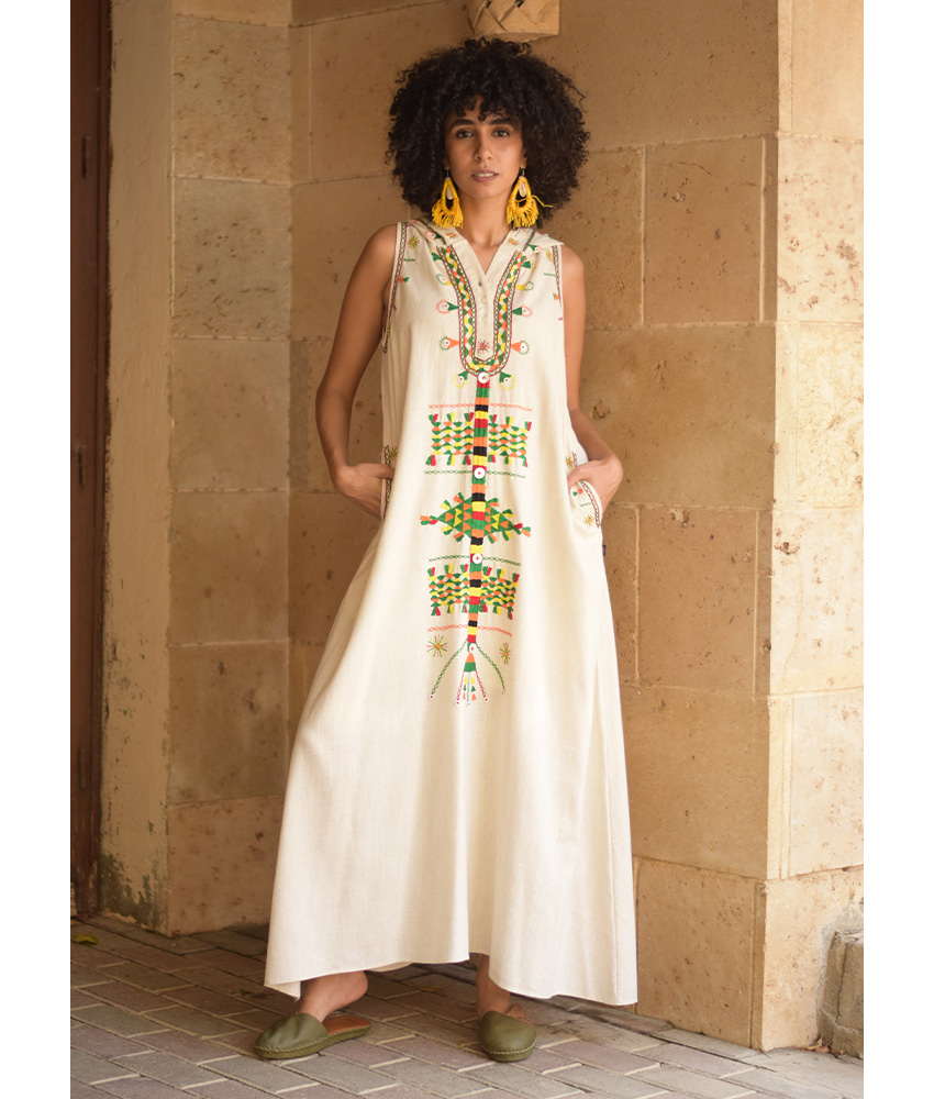 Off white Siwa Heavily Embroidered Linen Dress with Hoodie handmade in Egypt & available at Jozee Boutique.