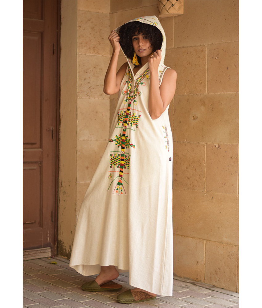 Off white Siwa Heavily Embroidered Linen Dress with Hoodie handmade in Egypt & available at Jozee Boutique.
