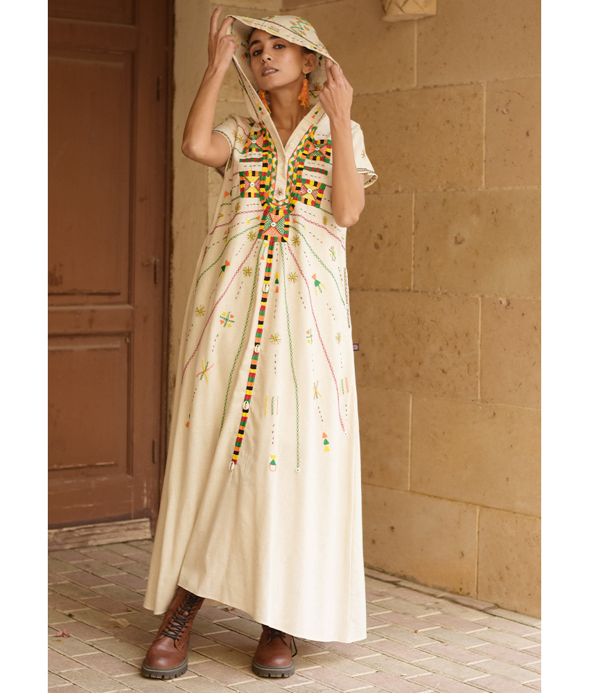 Off white Siwa Heavily Embroidered Linen Dress with Hoodie handmade in Egypt & available at Jozee Boutique.