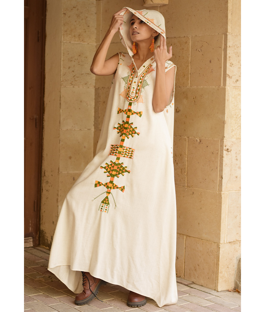 Off white Siwa Heavily Embroidered Linen Dress with Hoodie handmade in Egypt & available at Jozee Boutique.