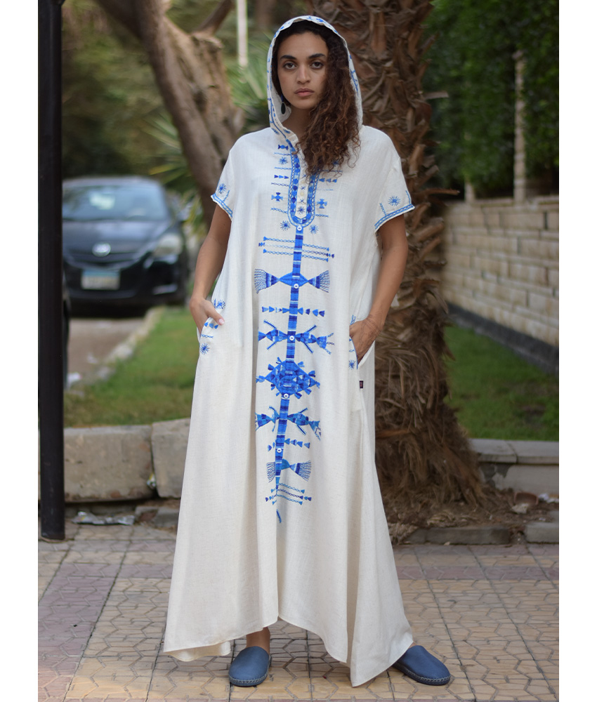 White Siwa Heavily Embroidered Linen Dress with Hoodie handmade in Egypt & available at Jozee Boutique.
