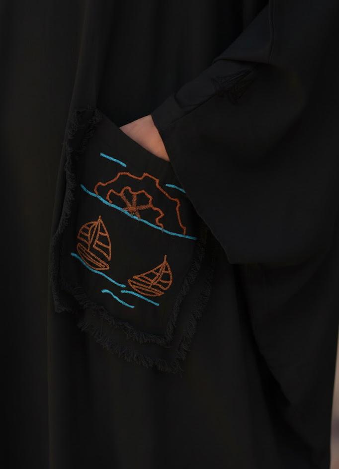 Black Hand Embroidered Linen Kaftan with Hoodie handmade in Egypt & available at Jozee Boutique.
