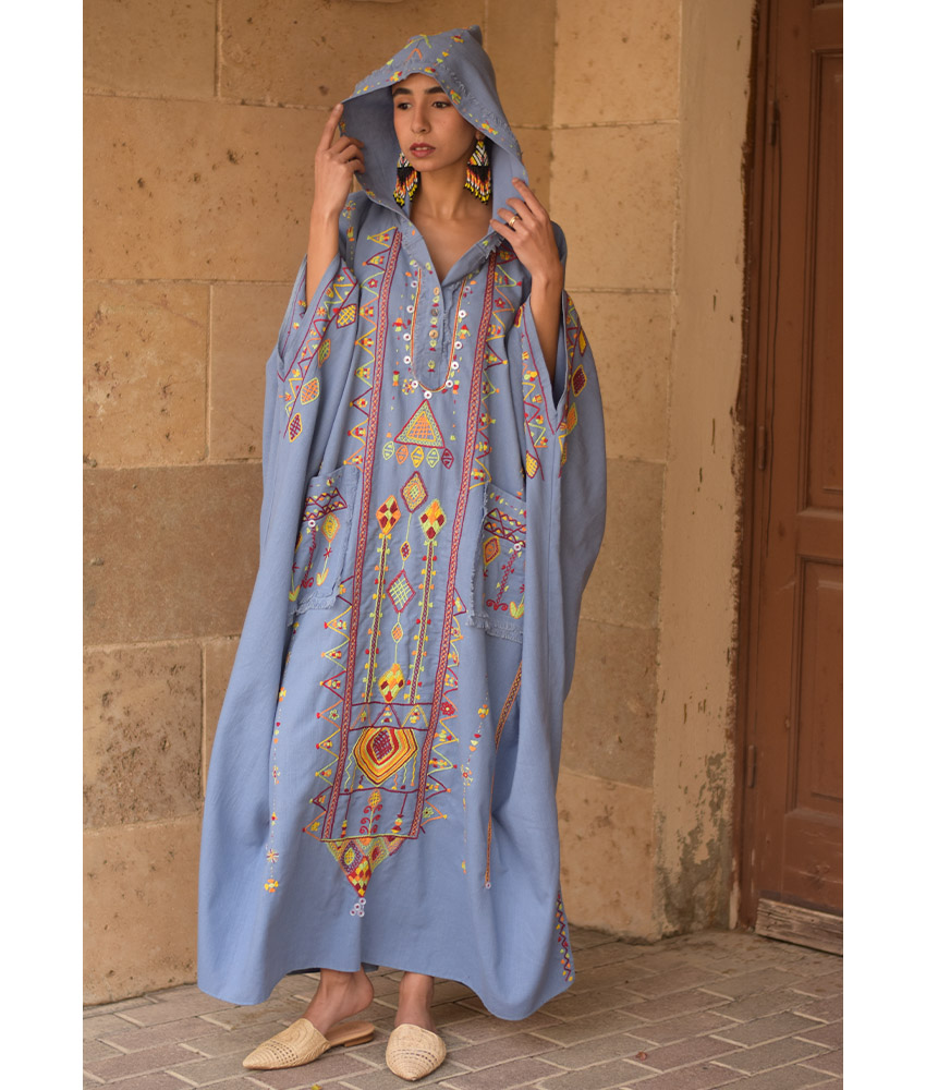Denim blue Siwa Heavily Embroidered Linen Kaftan with Hoodie handmade in Egypt & available at Jozee Boutique.