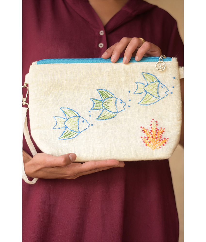 Off White Embroidered Floral Canvas Pouch handmade in Egypt & available at Jozee Boutique.handmade in Egypt & available at Jozee Boutique.