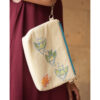 Off White Embroidered Floral Canvas Pouch handmade in Egypt & available at Jozee Boutique.handmade in Egypt & available at Jozee Boutique.